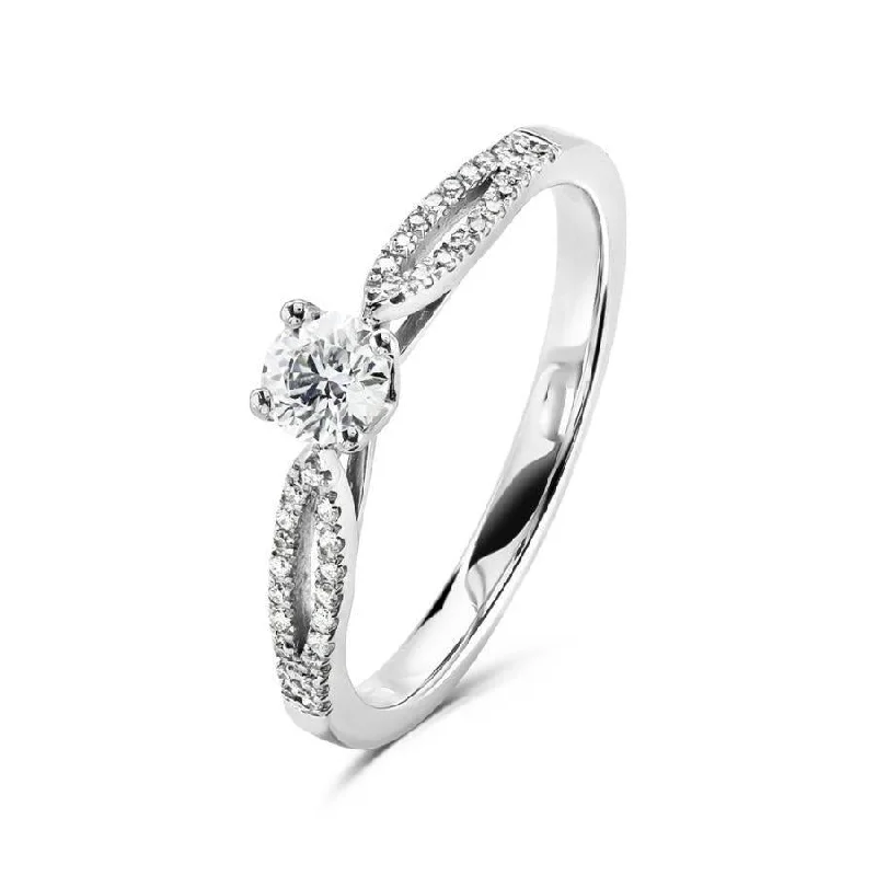 Luxe gem engagement rings-Platinum 4 claw set round brilliant cut Diamond solitaire ring with split claw set Diamond shoulders